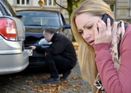 woman calling for police for a car accident that's not her fault