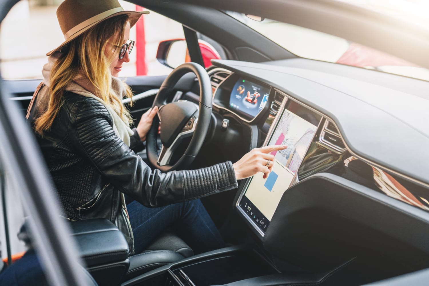 woman driving Tesla