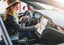 woman driving Tesla