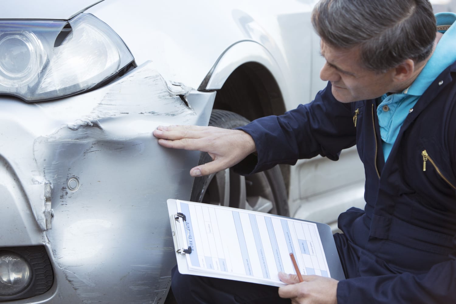 insurance adjuster is inspecting car accident claims