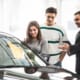 couple choosing car and asking car insurance grace period