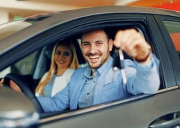 Young couple getting new non-owner car insurance for their new car